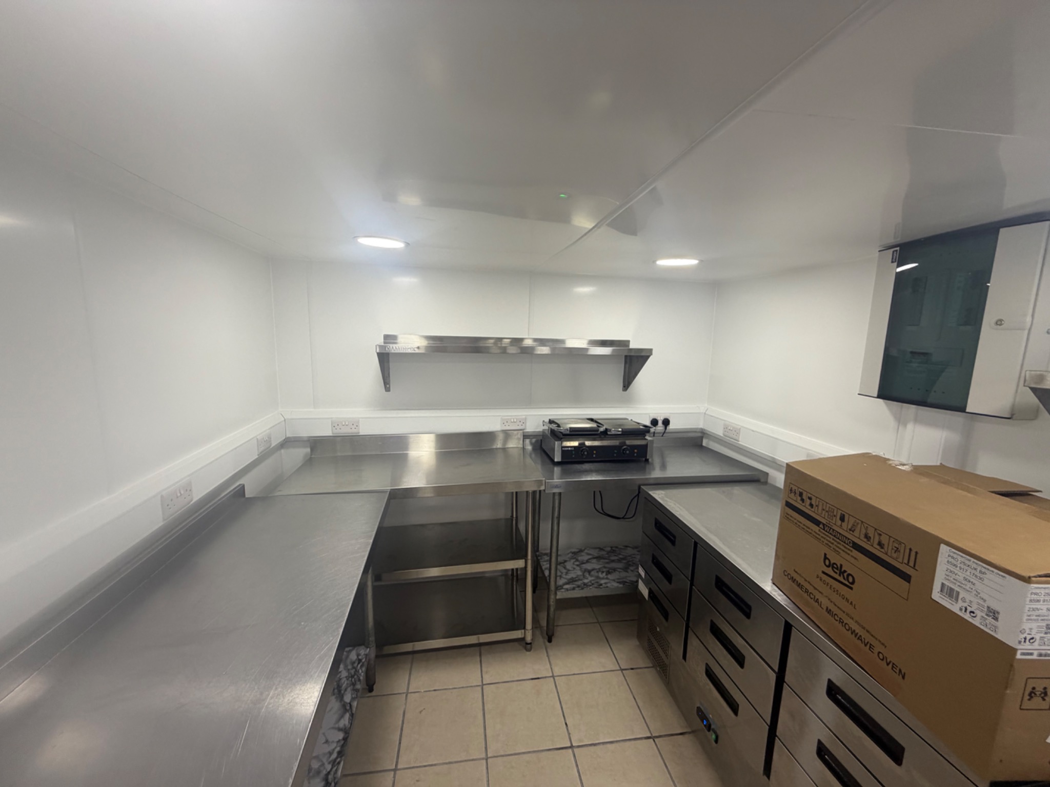 Commercial kitchen ceiling lighting and work area